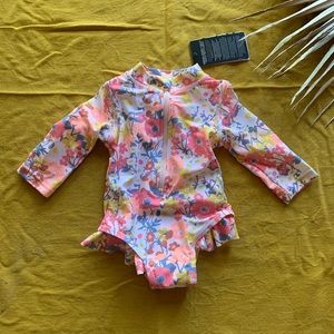 Long sleeve floral swimsuit w ruffles.